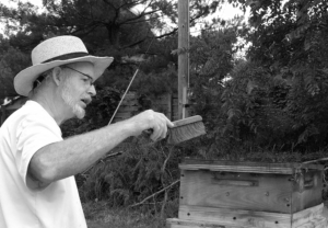 Gary W. Breisch tending to his Bees in 2016 at his Local Bee Keeper Outlet, an organic bee and farming acre.